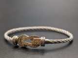 a close up of a bracelet with a knot on it