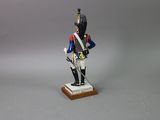 figurine of a toy soldier with a sword and uniform