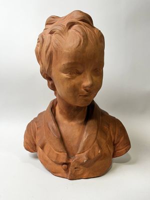 a clay bust of a woman on a white background