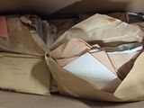 a cardboard box with a lot of papers inside of it