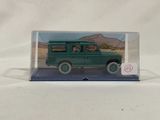 an image of a green toy truck in a clear box