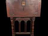an old wooden table with a drawer on top of it