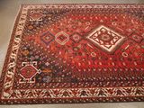 an oriental rug is on the floor in a room