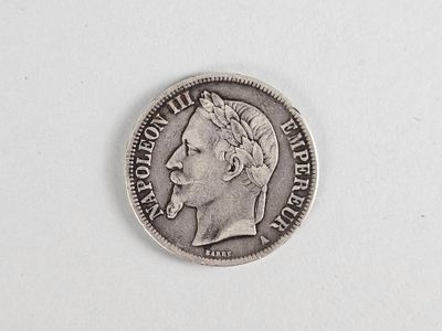 une vieille pièce d'argent sur laquelle est représenté le visage d'un homme