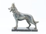statue of a dog on a marble base on a white background