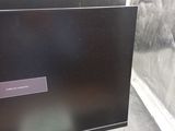a computer monitor that is sitting on a desk