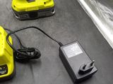 a cordless drill and a battery on a table