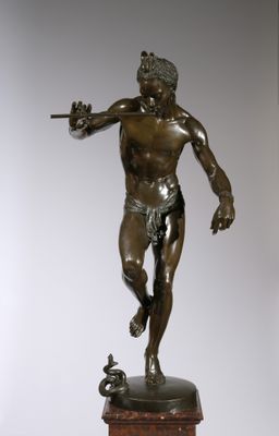 bronze statue of a man holding a sword on a wooden base