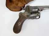a gun and a hat sitting on a table