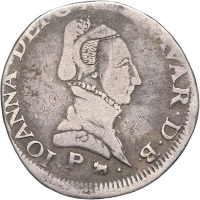 une vieille pièce d'argent sur laquelle figure la tête d'une femme coiffée d'une couronne