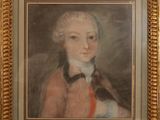 portrait of a young man in a red coat and a black bow tie