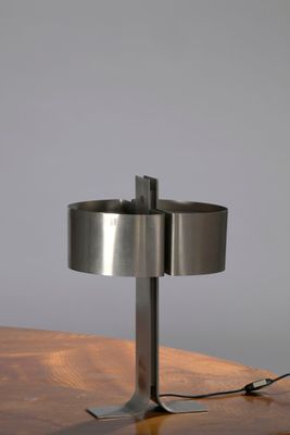 an image of a table with a lamp on top of it