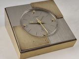 a clock that is sitting in a box on a table