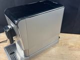 a coffee machine that is sitting on a wooden table