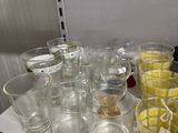many glasses on a shelf in a store