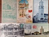 several old postcards of different buildings and buildings on a table