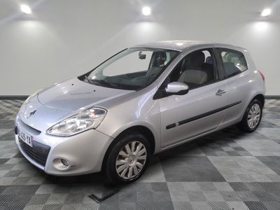 a picture of a small silver car parked in a garage