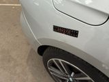 a close up of a car with a sticker on the side of it