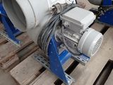 two blow pumps sitting on a pallet in a warehouse