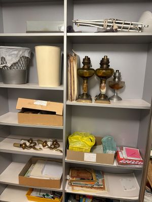 a shelf with many items on it in a room