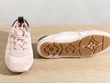 louis vuitti pink sneakers on a wooden surface