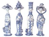four blue and white figurines of women with hats and flowers