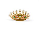 a close up of a gold ring with pearls and emeralds