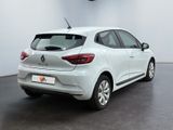 the rear end of a white car in a white room