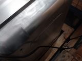 an image of a stainless steel dishwasher on a pallet