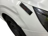 a close up of a car with a sticker on it