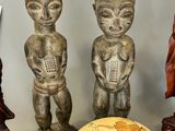 a lot of statues that are sitting on a table