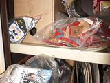 many items in a box on a shelf in a room