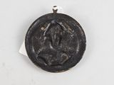 an image of a coin with a face on it