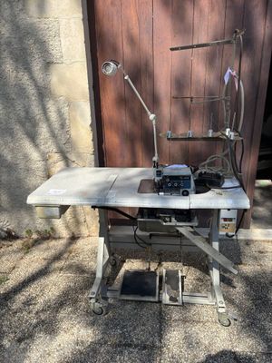 a sewing machine sitting on a table in front of a door