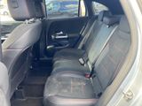 the back seats of a car are black with red stitching