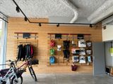 a bike that is parked in front of a wooden wall