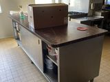 a large kitchen island with a box on top of it