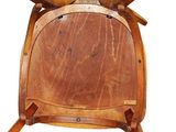 a wooden chair with two crossed legs and a wooden seat