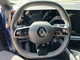 the interior of a car with a steering wheel and dashboard controls