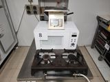 a microwave sitting on top of a stove in a kitchen