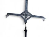 a close up of a metal cross on a white background