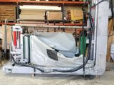 a machine that is sitting in a garage with a sheet covering it