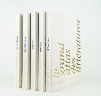 three books are stacked on top of each other on a white surface