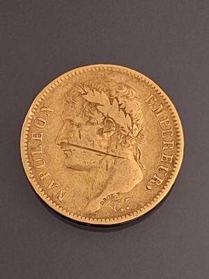 an image of a gold coin with a picture of a woman on it