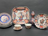 a group of plates and cups and saucers on a table