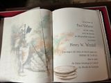 an open book with a drawing of a man on it