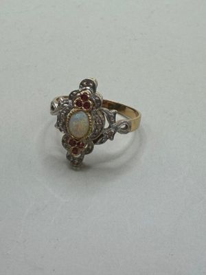a close up of a ring on a table with a white background