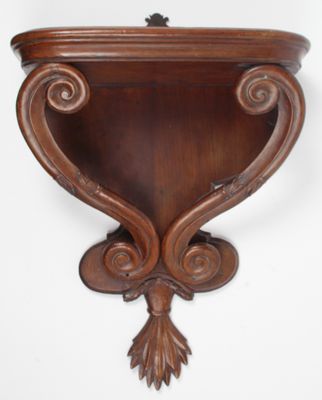 CONSOLE D’APPLIQUE, en acajou, montants à enroulements, cul …