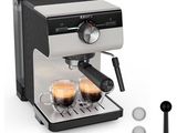 a close up of a coffee machine with two cups of coffee