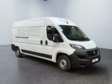 the white van is parked in the empty room of the building
